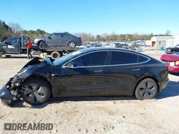2019 Tesla Model 3 Mid Range with VIN 5YJ3E1EA2KF306286, listed as a IAAI auction lot 41699127 with 56,249 mi miles and . Bid and sale history available at DreamBid. Image 14.