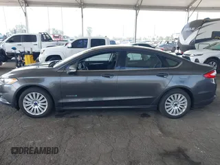 2015 Ford Fusion SE Hybrid with VIN 3FA6P0LU6FR309099, listed as a IAAI auction lot 42497429 with 157,631 mi miles and . Bid and sale history available at DreamBid. Image 14.