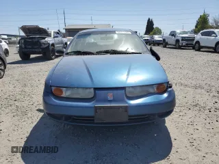 2001 Saturn SL z VIN 1G8ZK547X1Z294553, wystawiony jako Copart lot #53786805 z przebiegiem 288 011 mil mil oraz Szkody całkowita. Historia ofert i sprzedaży dostępna na DreamBid. Obrazek 5.