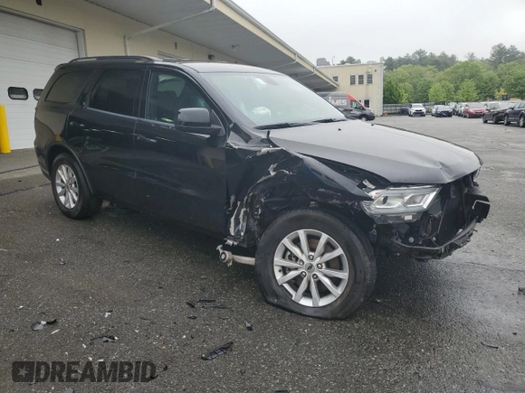 2023 Dodge Durango SXT with VIN 1C4RDHAG5PC634936, listed as a Copart auction lot 57282195 with 56,689 mi miles and Salvage title. Bid and sale history available at DreamBid. Image 4.