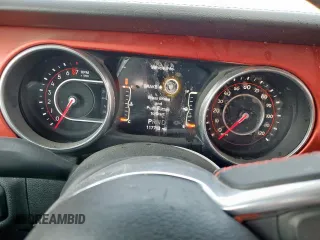 2018 Jeep Wrangler Unlimited Rubicon with VIN 1C4HJXFG6JW166731, listed as a Copart auction lot 56997385 with 117,713 mi miles and Salvage title. Bid and sale history available at DreamBid. Image 9.