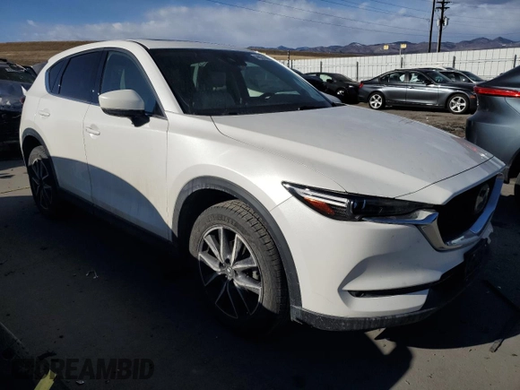 2018 Mazda CX-5 Grand Touring with VIN JM3KFADM3J1410210, listed as a Copart auction lot 44031365 with 69,016 mi miles and Clean Title. Bid and sale history available at DreamBid. Image 4.