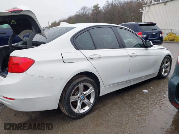 2014 BMW 3 Series 328i xDrive with VIN WBA3B5C56EF599323, listed as a IAAI auction lot 41853533 with 114,358 mi miles. Bid and sale history available at carsss.com. Image 4.