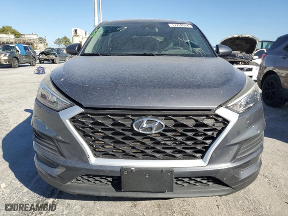 2019 Hyundai Tucson SE with VIN KM8J23A41KU945578, listed as a Copart auction lot 77248584 with 69,359 mi miles and Salvage Title. Bid and sale history available at carsss.com. Image 5.