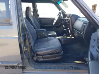 1997 Jeep Cherokee Sport with VIN 1J4FJ68S4VL567490, listed as a IAAI auction lot 41659872 with 404,766 mi miles. Bid and sale history available at carsss.com. Image 5.