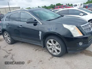 2011 Cadillac SRX Premium Collection z VIN 3GYFNCEY3BS660339, wystawiony jako IAAI lot #42154418 z przebiegiem 203 627 mil mil oraz . Historia ofert i sprzedaży dostępna na DreamBid. Obrazek 1.