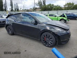 2023 Tesla Model Y Performance with VIN 7SAYGDEF8PF762915, listed as a Copart auction lot 50270285 with 23,893 mi miles and Salvage Title. Bid and sale history available at DreamBid. Image 4.
