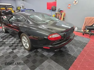 1997 Jaguar XK with VIN SAJGX5748VC006720, listed as a Copart auction lot 80928284 with 96,279 mi miles and Clean Title. Bid and sale history available at DreamBid. Image 3.