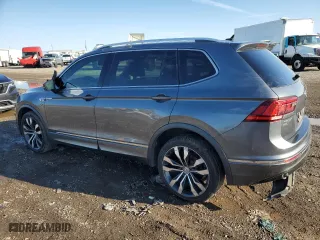 2020 Volkswagen Tiguan SEL Premium R-Line with VIN 3VV4B7AXXLM068664, listed as a Copart auction lot 83243264 with 132,734 mi miles and Salvage Title. Bid and sale history available at carsss.com. Image 2.