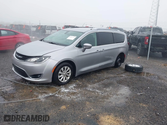 2018 Chrysler Pacifica Touring L with VIN 2C4RC1BGXJR142295, listed as a IAAI auction lot 41952592 with 135,092 mi miles and . Bid and sale history available at DreamBid. Image 2.