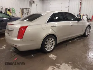 2014 Cadillac CTS Luxury AWD with VIN 1G6AX5S3XE0197628, listed as a IAAI auction lot 41400988 with 144,026 mi miles and . Bid and sale history available at DreamBid. Image 4.