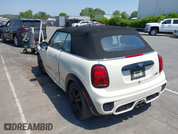2021 MINI Convertible with VIN WMWWJ9C0XM3M07302, listed as a IAAI auction lot 42027854 with 30,921 mi miles and . Bid and sale history available at DreamBid. Image 3.