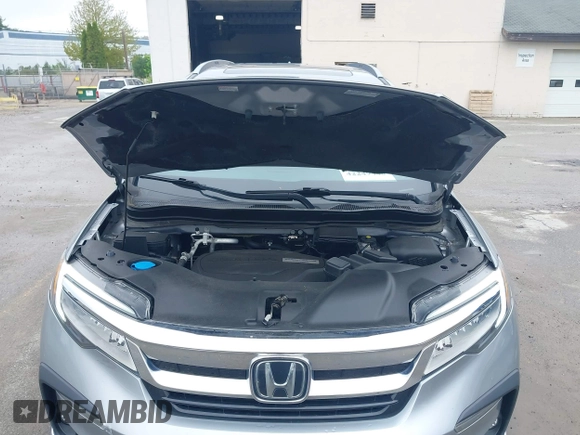 2020 Honda Pilot Touring 8-Passenger z VIN 5FNYF6H91LB042626, wystawiony jako IAAI lot #42249440 z przebiegiem 57 429 mil mil oraz . Historia ofert i sprzedaży dostępna na DreamBid. Obrazek 10.