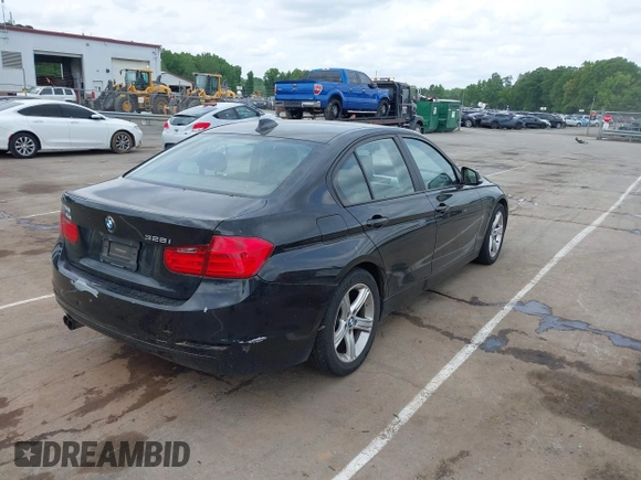 2012 BMW 3 Series 328i with VIN WBA3A5G51CNP17522, listed as a IAAI auction lot 42124868 with 154,385 mi miles and . Bid and sale history available at carsss.com. Image 4.