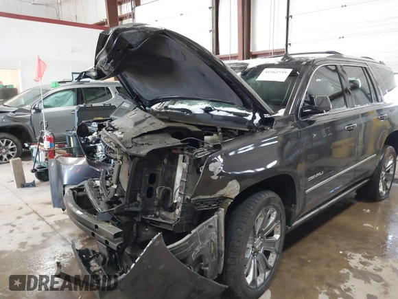 2016 GMC Yukon Denali with VIN 1GKS2CKJ8GR215954, listed as a IAAI auction lot 41362739 with 143,982 mi miles. Bid and sale history available at carsss.com. Image 6.