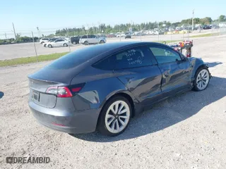 2023 Tesla Model 3 with VIN 5YJ3E1EA2PF642253, listed as a IAAI auction lot 41777160 with 29,817 mi miles. Bid and sale history available at carsss.com. Image 4.