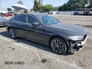 2023 BMW 5 Series 530i with VIN WBA53BH05PCM01563, listed as a Copart auction lot 55525515 with 23,371 mi miles and Salvage title. Bid and sale history available at DreamBid. Image 4.