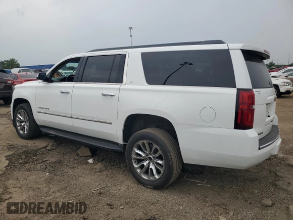 2015 Chevrolet Suburban LT z VIN 1GNSKJKC5FR261474, wystawiony jako Copart lot #60679775 z przebiegiem 128 851 mil mil oraz Czysty tytuł • Clean title. Historia ofert i sprzedaży dostępna na DreamBid. Obrazek 2.