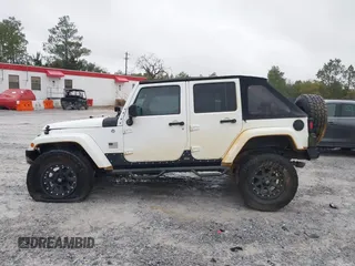 2014 Jeep Wrangler Unlimited Sahara with VIN 1C4BJWEG0EL151473, listed as a IAAI auction lot 41600726 with 119,057 mi miles. Bid and sale history available at carsss.com. Image 14.