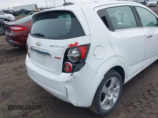 2016 Chevrolet Sonic LTZ z VIN 1G1JE6SB9G4146075, wystawiony jako IAAI lot #41750534 z przebiegiem 103 240 mil mil oraz . Historia ofert i sprzedaży dostępna na DreamBid. Obrazek 6.