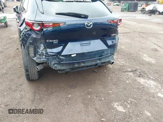 2022 Mazda CX-30 S Premium with VIN 3MVDMBDL0NM413545, listed as a IAAI auction lot 42493594 with 57,013 mi miles and . Bid and sale history available at DreamBid. Image 6.