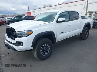 2023 Toyota Tacoma SR z VIN 3TMCZ5AN0PM541700, wystawiony jako IAAI lot #41819408 z przebiegiem 14 216 mil mil oraz . Historia ofert i sprzedaży dostępna na DreamBid. Obrazek 2.