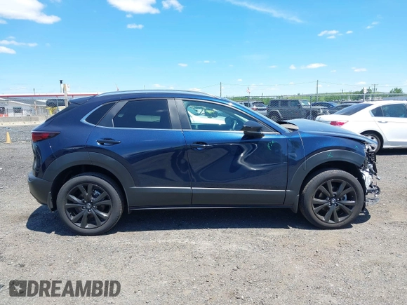 2024 Mazda CX-30 S Select Sport with VIN 3MVDMBBM2RM657781, listed as a IAAI auction lot 42297311 with 13,677 mi miles and . Bid and sale history available at DreamBid. Image 13.