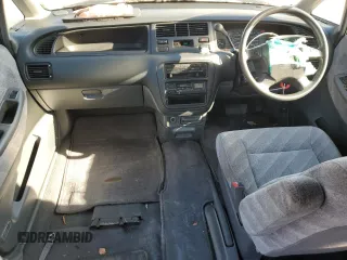 1997 Honda Odyssey with VIN RA11239041, listed as a Copart auction lot 85819024 with 79,952 mi miles and Salvage title. Bid and sale history available at DreamBid. Image 8.