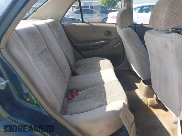1999 Mazda Protege DX z VIN JM1BJ2229X0189290, wystawiony jako IAAI lot #41796448 z przebiegiem 281 528 mil mil oraz . Historia ofert i sprzedaży dostępna na DreamBid. Obrazek 8.