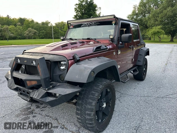 2007 Jeep Wrangler Unlimited X with VIN 1J8GA39147L156911, listed as a Copart auction lot 65987405 with 115,766 mi miles and Clean title. Bid and sale history available at DreamBid. Image 2.