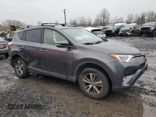 2018 Toyota RAV4 XLE with VIN JTMRFREV0JJ200337, listed as a Copart auction lot 84901594 with 57,301 mi miles and Salvage Title. Bid and sale history available at DreamBid. Image 4.