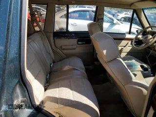 1993 Jeep Cherokee Country with VIN 1J4FJ78S4PL517648, listed as a Copart auction lot 72383564 with 127,156 mi miles and Salvage Title. Bid and sale history available at carsss.com. Image 11.