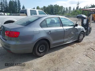 2013 Volkswagen Jetta S z VIN 3VW1K7AJ5DM242345, wystawiony jako IAAI lot #42598698 z przebiegiem 169 870 mil mil oraz . Historia ofert i sprzedaży dostępna na DreamBid. Obrazek 4.