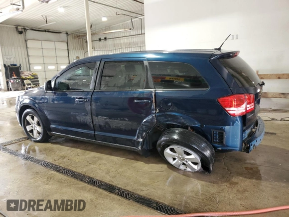 2013 Dodge Journey American Value with VIN 3C4PDCAB4DT581984, listed as a Copart auction lot 59953515 with 166,927 mi miles and Salvage title. Bid and sale history available at DreamBid. Image 2.