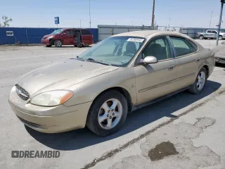 2001 Ford Taurus SES z VIN 1FAFP55S81A145754, wystawiony jako Copart lot #58266945 z przebiegiem 210 716 mil mil oraz Czysty tytuł • Clean title. Historia ofert i sprzedaży dostępna na DreamBid. Obrazek 1.