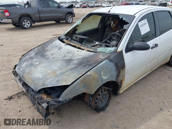 2007 Ford Focus S z VIN 1FAFP34N97W185370, wystawiony jako IAAI lot #41692669 z przebiegiem Nie podano mil oraz . Historia ofert i sprzedaży dostępna na DreamBid. Obrazek 6.