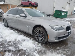 2011 BMW 7 Series 740Li with VIN WBAKB4C54BC574892, listed as a IAAI auction lot 41165432 with 115,489 mi miles. Bid and sale history available at carsss.com. Image 1.
