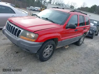 1999 Jeep Grand Cherokee Laredo with VIN 1J4GW58S0XC519908, listed as a IAAI auction lot 41789905 with 221,064 mi miles. Bid and sale history available at carsss.com. Image 18.
