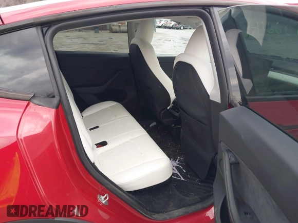 2023 Tesla Model Y Long Range with VIN 7SAYGDEE1PA169031, listed as a IAAI auction lot 41660766 with 35,253 mi miles and . Bid and sale history available at DreamBid. Image 8.