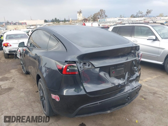 2024 Tesla Model Y with VIN 7SAYGDED8RF116209, listed as a IAAI auction lot 41761804 with 12,048 mi miles and . Bid and sale history available at DreamBid. Image 3.