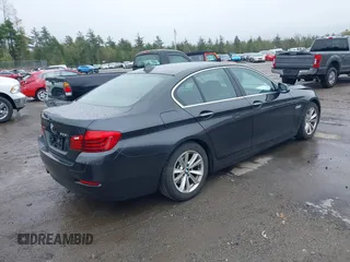 2015 BMW 5 Series 528i xDrive with VIN WBA5A7C59FG142685, listed as a IAAI auction lot 42181388 with 124,482 mi miles and . Bid and sale history available at DreamBid. Image 4.