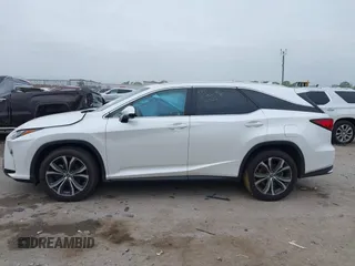 2018 Lexus RX 350L Premium z VIN JTJDZKCAXJ2010125, wystawiony jako IAAI lot #41899420 z przebiegiem 113 995 mil mil oraz . Historia ofert i sprzedaży dostępna na DreamBid. Obrazek 14.