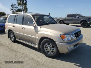 2001 Lexus LX 470 z VIN JTJHT00W213507042, wystawiony jako Copart lot #52634195 z przebiegiem 179 707 mil mil oraz Tytuł czysty. Historia ofert i sprzedaży dostępna na DreamBid. Obrazek 4.
