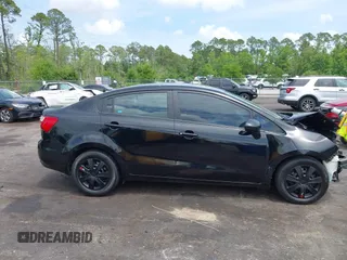 2014 Kia Rio LX with VIN KNADM4A33E6335499, listed as a IAAI auction lot 42123085 with 148,146 mi miles and . Bid and sale history available at DreamBid. Image 13.