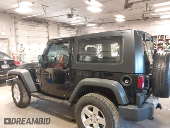 2007 Jeep Wrangler X with VIN 1J8FA24167L230763, listed as a IAAI auction lot 41876090 with 130,136 mi miles and . Bid and sale history available at carsss.com. Image 14.