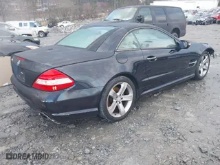 2009 Mercedes-Benz SL-Class V8 with VIN WDBSK71F29F143653, listed as a IAAI auction lot 41310556 with 115,377 mi miles. Bid and sale history available at carsss.com. Image 4.
