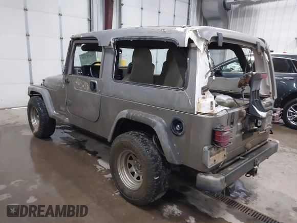 2006 Jeep Wrangler Unlimited LWB with VIN 1J4FA44S96P714309, listed as a IAAI auction lot 41252391 with 164,720 mi miles. Bid and sale history available at carsss.com. Image 3.