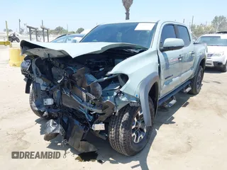 2022 Toyota Tacoma SR with VIN 3TYCZ5AN0NT104300, listed as a IAAI auction lot 42652503 with 18,071 mi miles and . Bid and sale history available at DreamBid. Image 2.