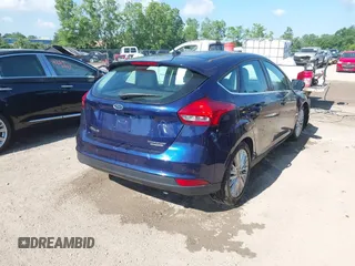2016 Ford Focus Titanium with VIN 1FADP3N23GL231613, listed as a IAAI auction lot 42645683 with 76,072 mi miles and . Bid and sale history available at DreamBid. Image 4.