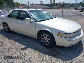 2000 Cadillac Seville Touring STS z VIN 1G6KY5495YU145937, wystawiony jako IAAI lot #42330143 z przebiegiem 217 894 mil mil oraz . Historia ofert i sprzedaży dostępna na DreamBid. Obrazek 1.